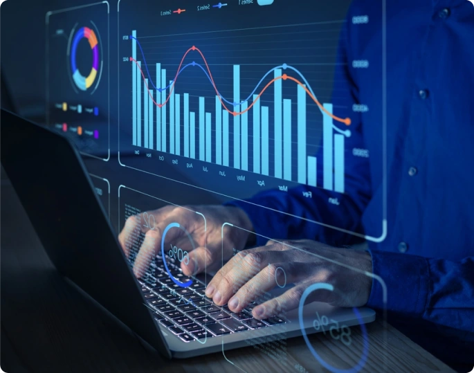 Person typing on a laptop with overlayed data visualizations, including charts and graphs, representing innovative financial analysis and data-driven decision making.